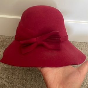 Red bow hat — would say it’s a medium large as it fits my head